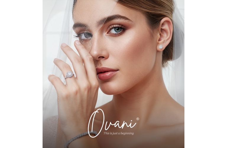 A couple holding hands with an engagement ring and a tulip symbolizing love, representing the Ovani jewelry collection.